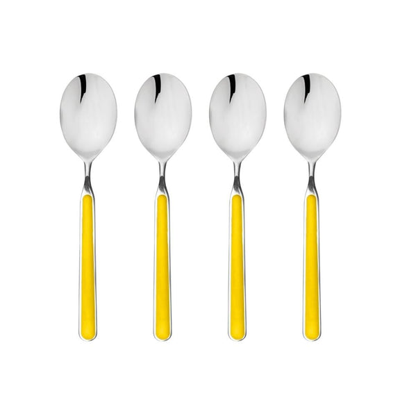 Four silver spoons with yellow handles on a white background