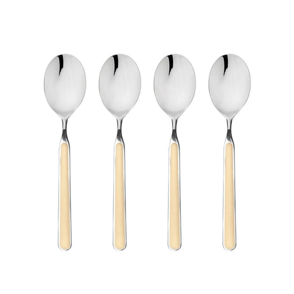 Four silver spoons with beige handles on a white background