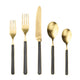 Set of gold cutlery with black handles on a white background