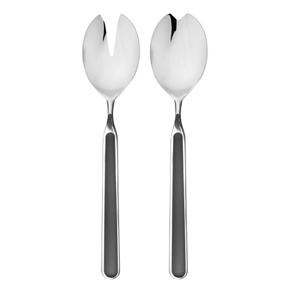 Two silver salad servers on a white background