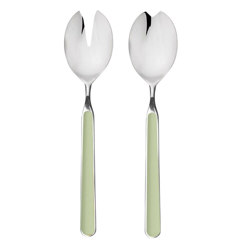Two silver salad servers with green handles on a white background