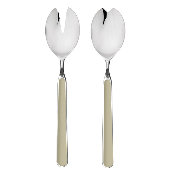 Two silver salad servers with beige handles on a white background