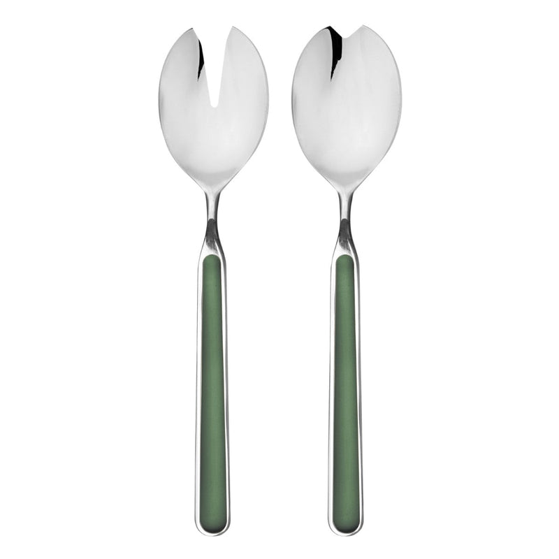 Two silver salad servers with green handles on a white background