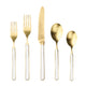Set of gold cutlery with white handles on a white background