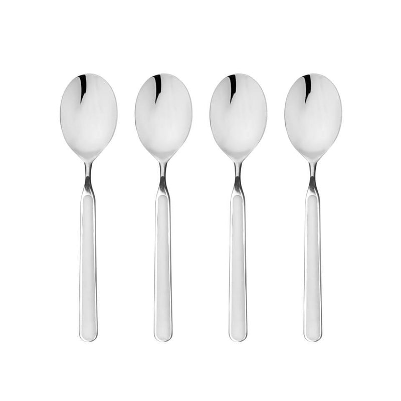 Set of four silver spoons on a white background
