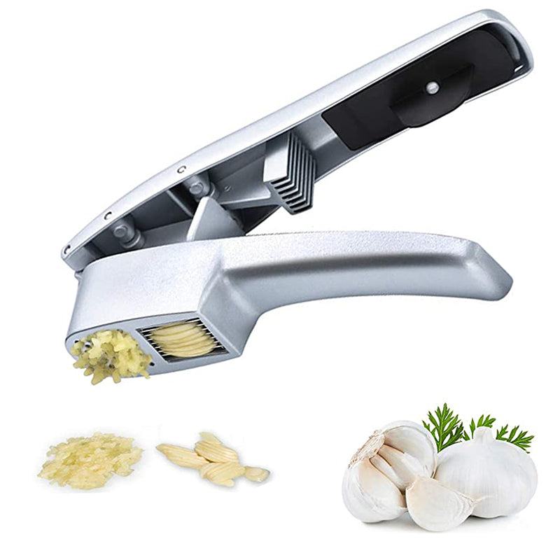 Garlic press with garlic cloves and minced garlic on a white background