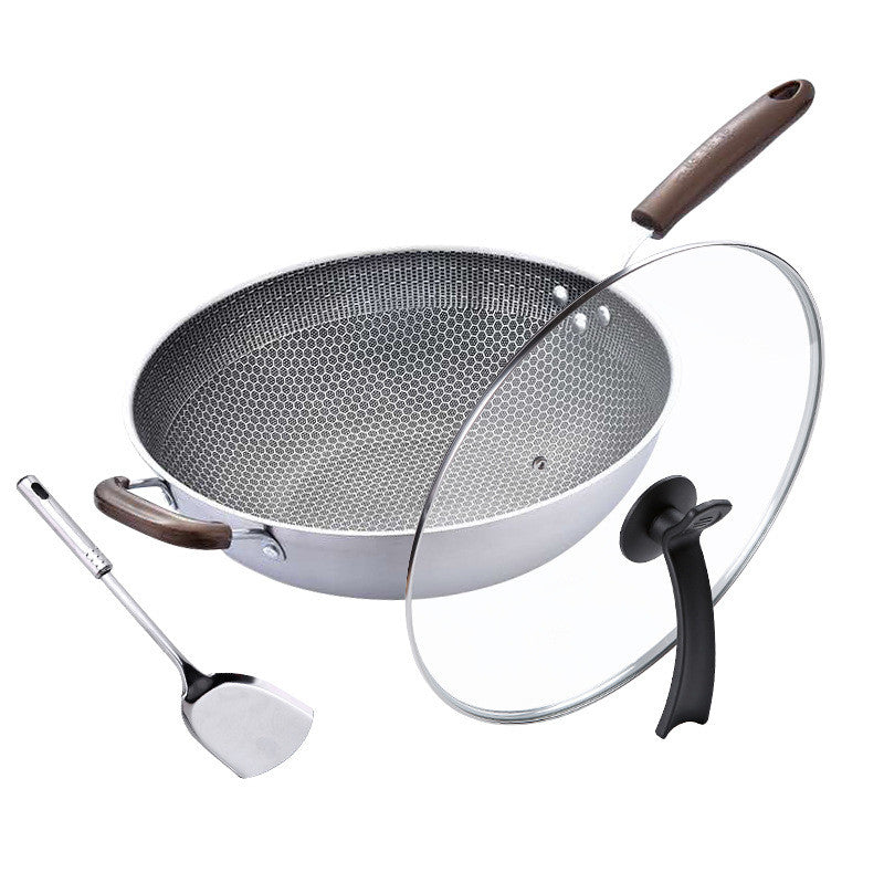 Wok with wooden handle, spatula, and glass lid on a white background