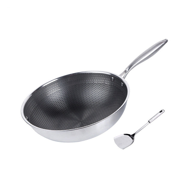 Stainless steel wok with a spatula on a white background