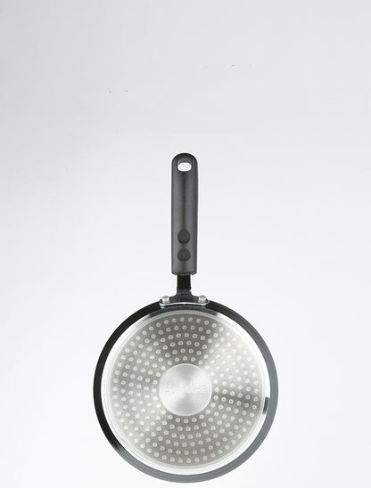 Frying pan with a perforated bottom on a white background
