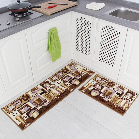 Two kitchen mats with decorative patterns on a white floor in a kitchen setting.
