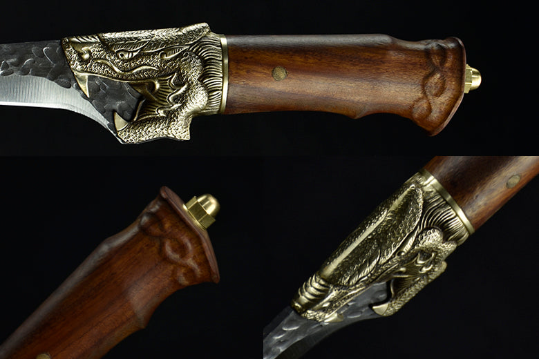 Decorative knife with wooden handle and gold embellishments on a black background