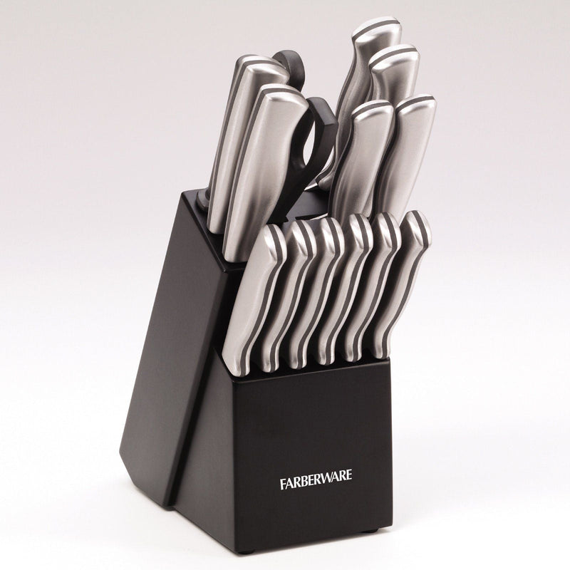 Set of knives in a black block with Farberware branding on a light gray background