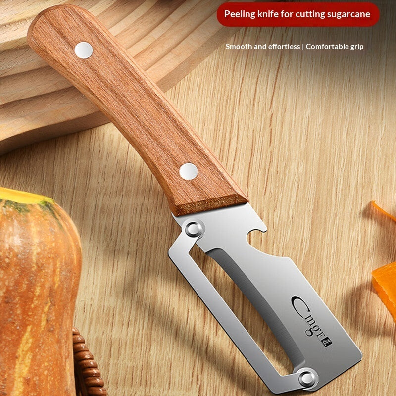 Peeling knife for cutting sugarcane with wooden handle on a wooden surface