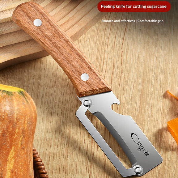 Peeling knife for cutting sugarcane with wooden handle on a wooden surface