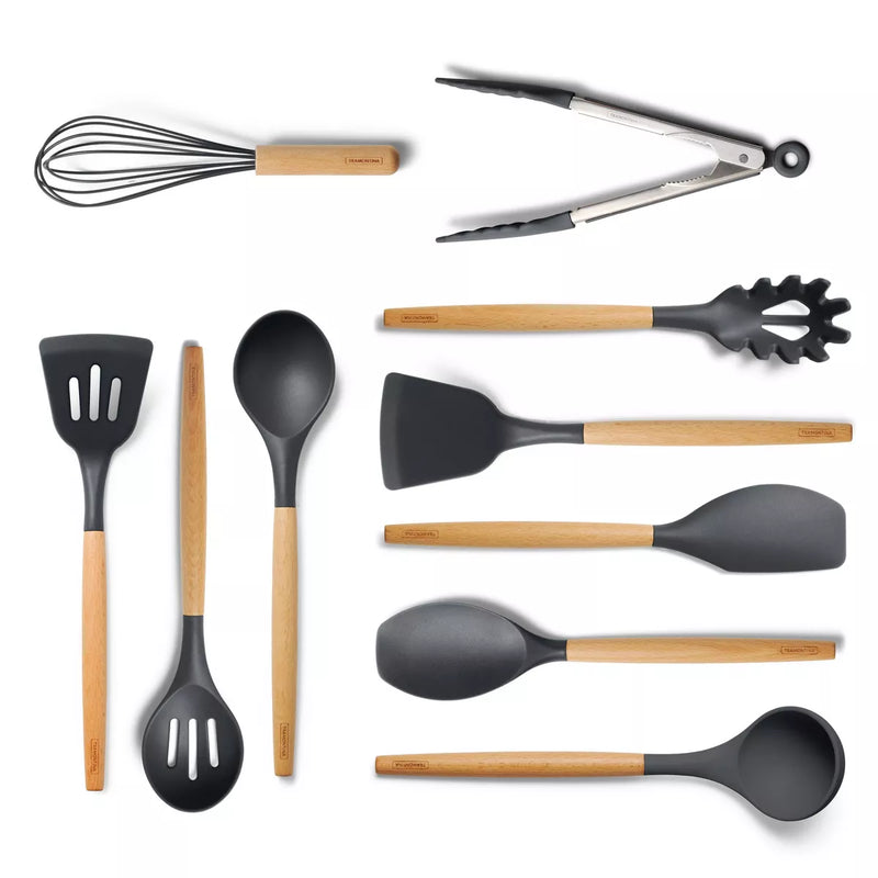 Set of kitchen utensils with black silicone heads and wooden handles on a white background