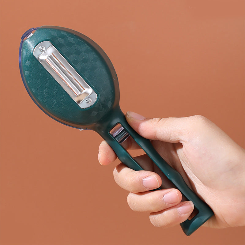 Hand holding a green vegetable peeler against a brown background
