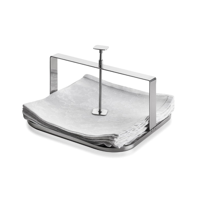 Napkin holder with folded white napkins on a white background