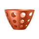 Copper-colored Centerpiece with perforated design on a white background