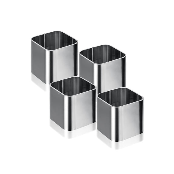 Set of four metallic square-shaped napkin rings on a white background