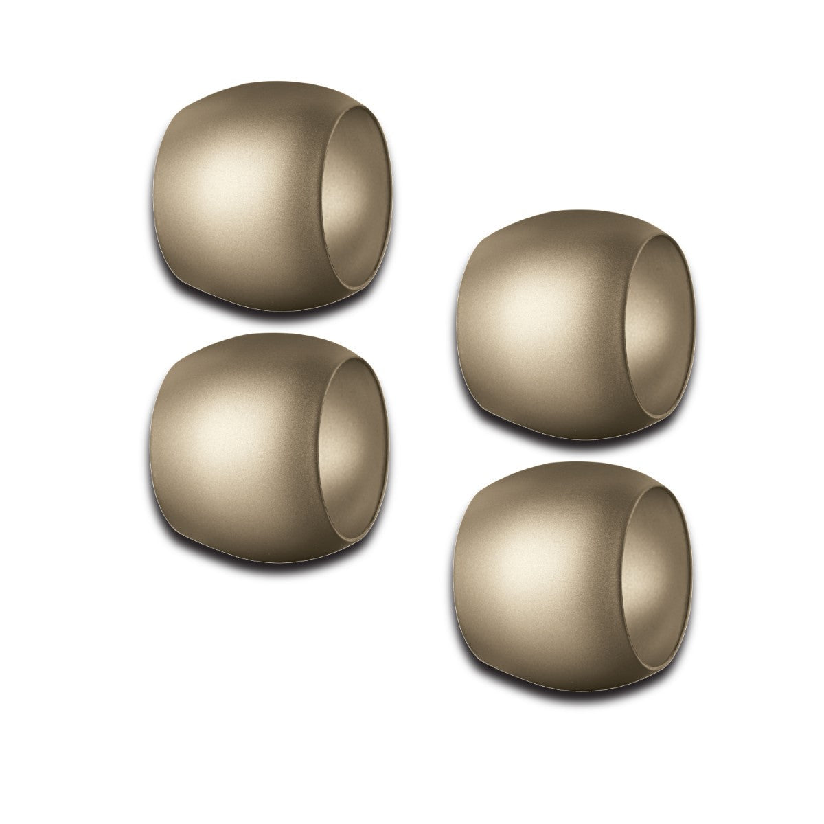 Four gold Mepra napkin rings on a white background