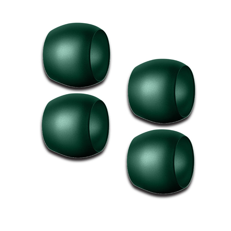 Four green Mepra napkin rings on a white background