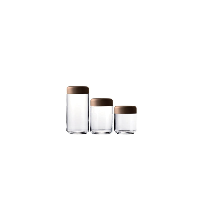 Three glass containers with wooden lids on a white background