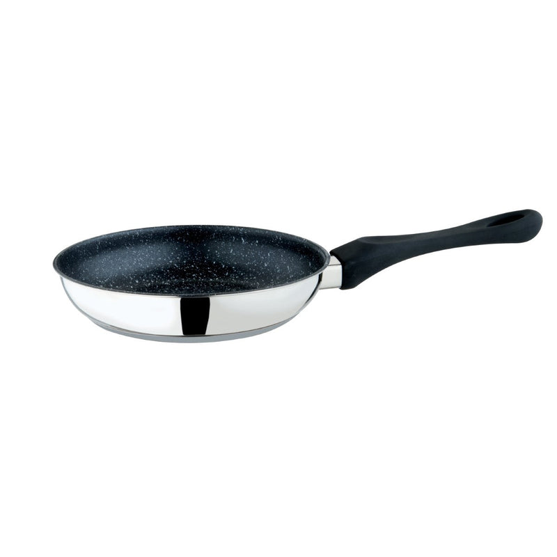 Frying pan with black speckled exterior and silver interior on a white background