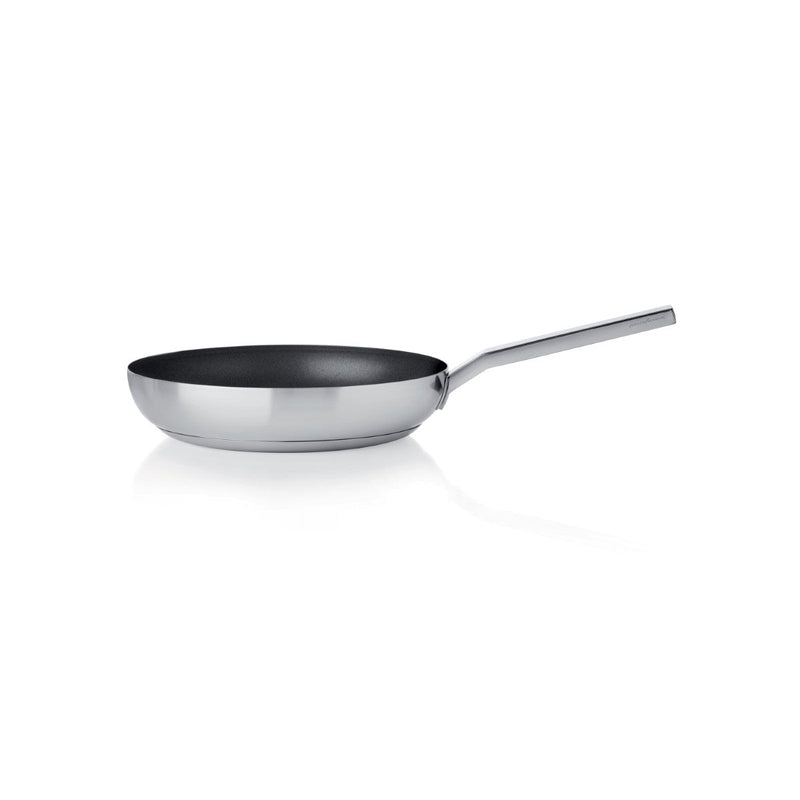 Stainless steel frying pan on a white background