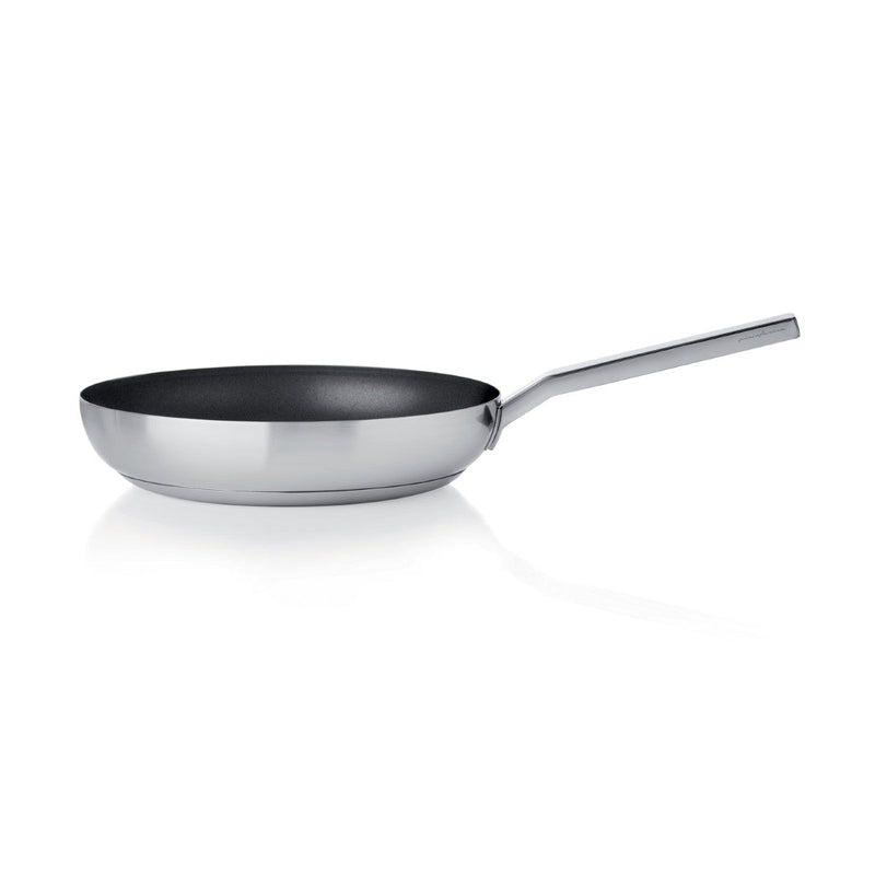 Stainless steel frying pan on a white background