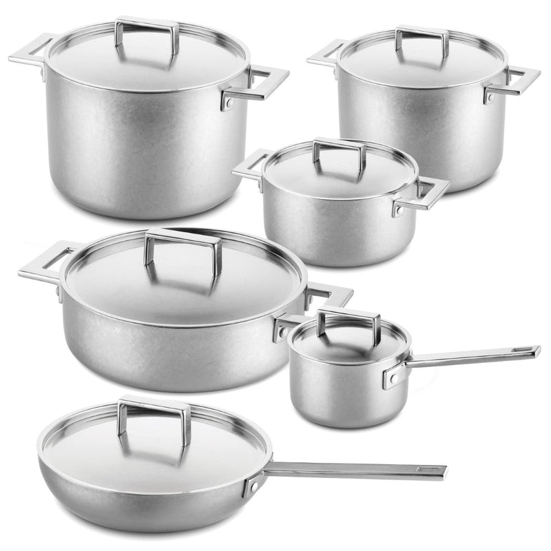Set of stainless steel cookware with lids on a white background