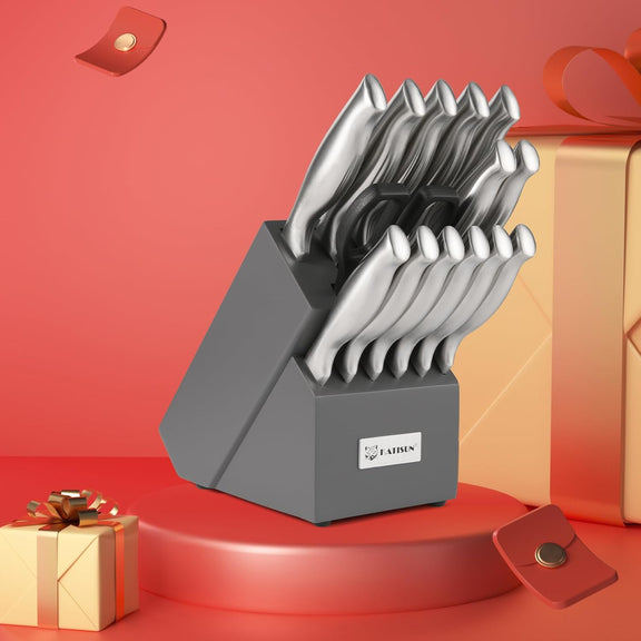 Set of knives in a gray block with a red background and gift boxes.