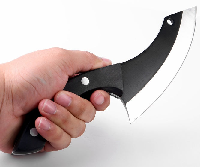 Hand holding a black curved knife against a white background