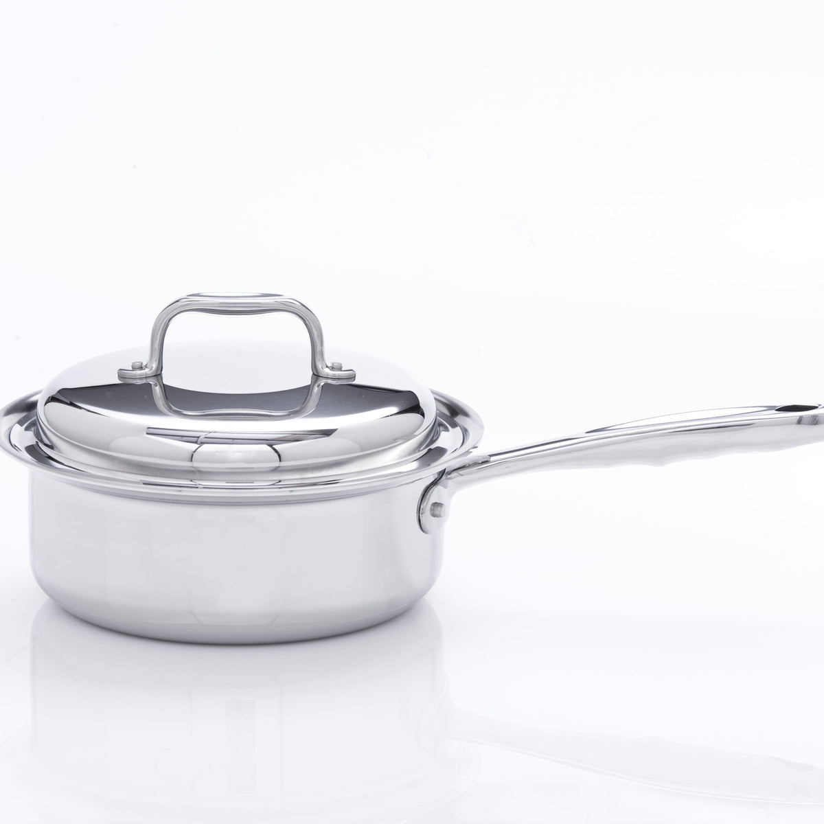 Stainless steel saucepan with lid on a white background