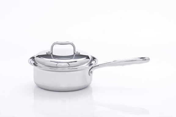 Stainless steel saucepan with lid on a white background