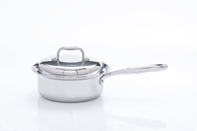 Stainless steel saucepan with lid on a white background