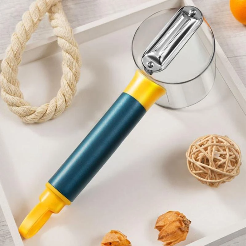 Peeler with blue and yellow handle on a white surface with decorative items