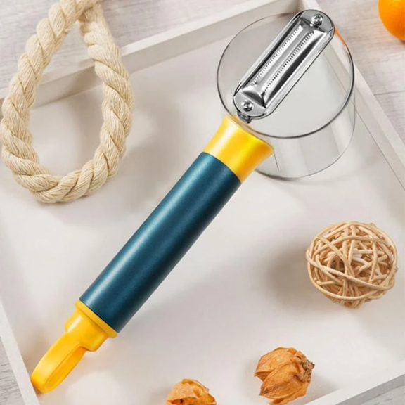 Peeler with blue and yellow handle on a white surface with decorative items