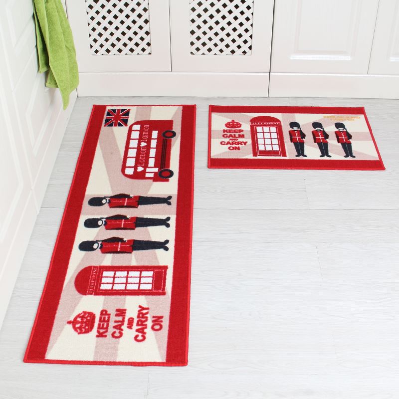 Two decorative mats with British-themed designs on a white floor.