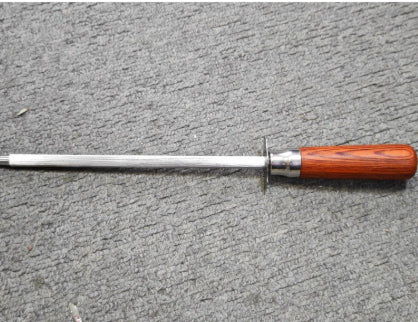 Knife Sharpener with wooden handle on a gray surface