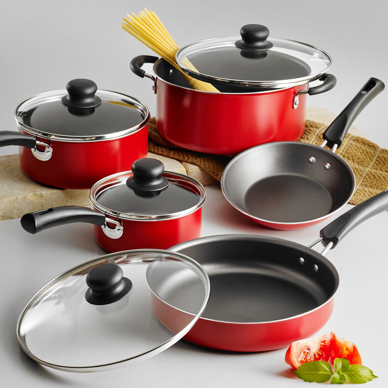 Set of red cookware with black handles and lids on a light gray background.