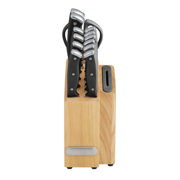 Set of knives with wooden block on a white background