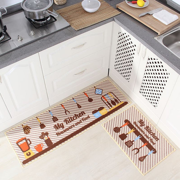 Two kitchen mats with decorative patterns on a kitchen floor.