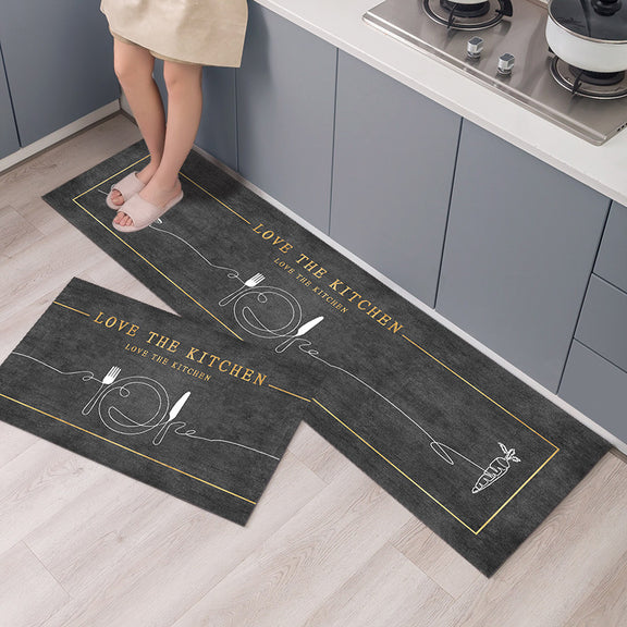 Two kitchen mats with 'Love the Kitchen' text on a wooden floor.