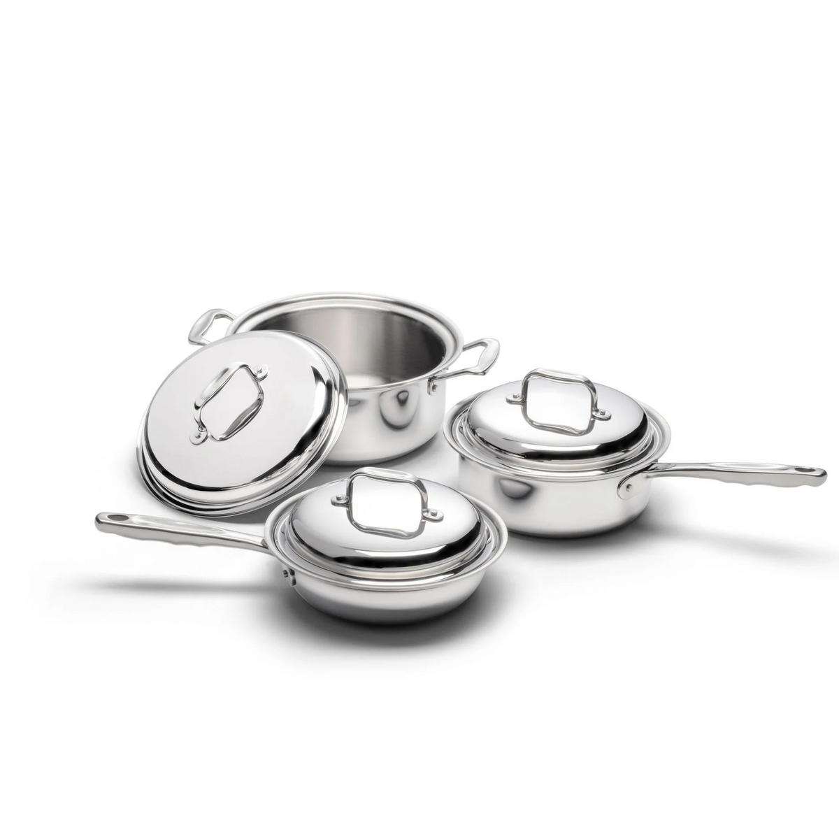 Set of stainless steel cookware with lids on a white background