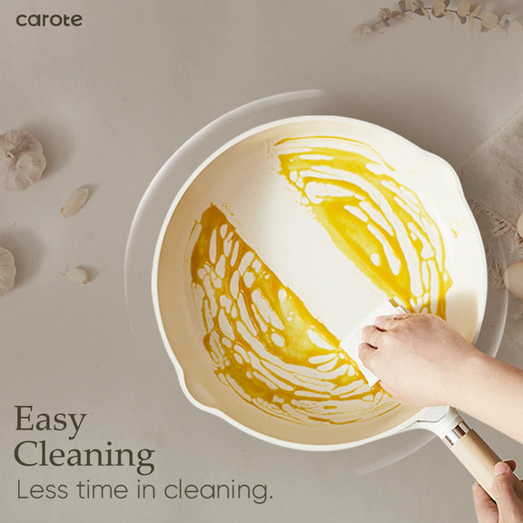 Person cleaning a pan with yellow residue using a scrubber, with 'carote' brand visible.