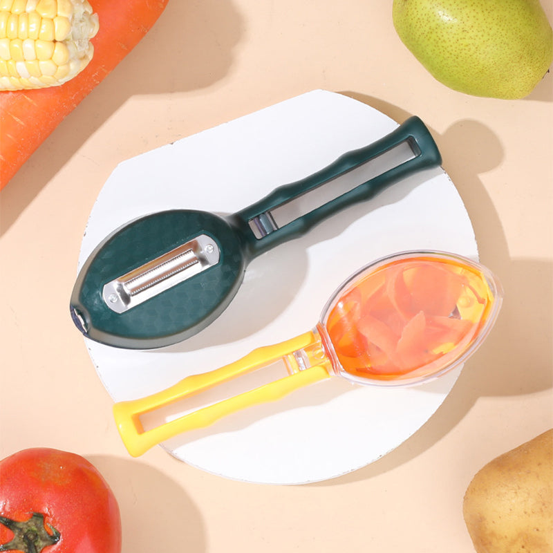 Multifunctional kitchen tool with peeler and fruit corer on a beige background with fruits and vegetables.