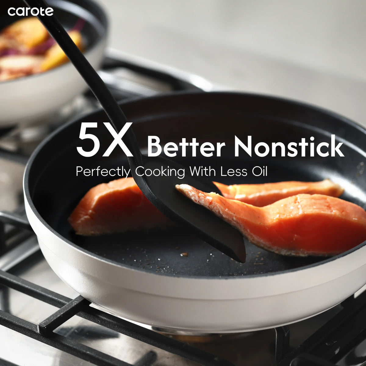Frying pan with salmon being cooked on a stove, featuring carote brand text.