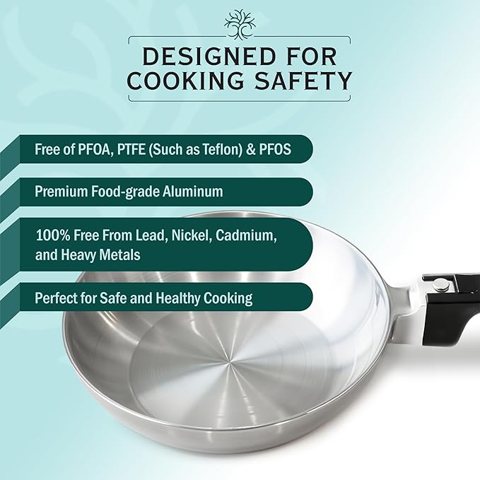 Stainless steel frying pan with safety features text on a light blue background
