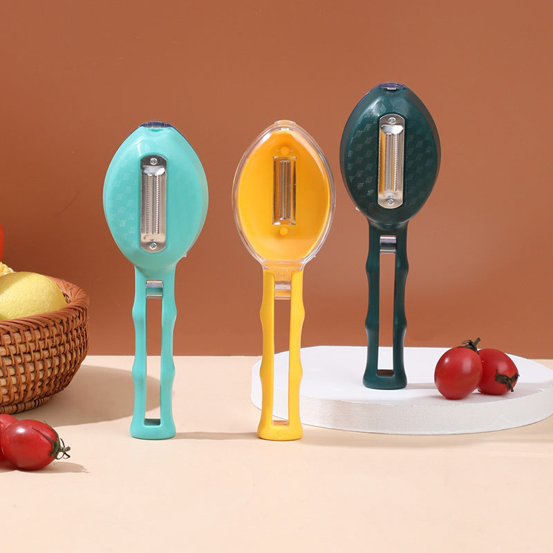 Three colorful vegetable peelers on a neutral background with fruits and vegetables.