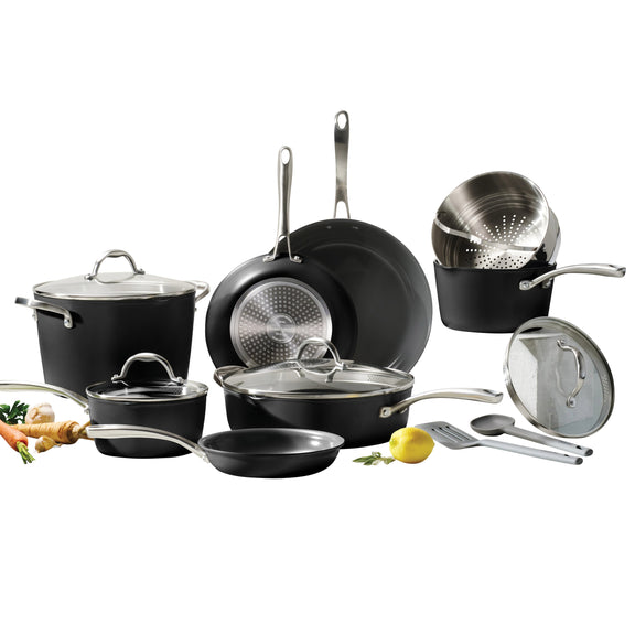 Set of black cookware with lids on a white background